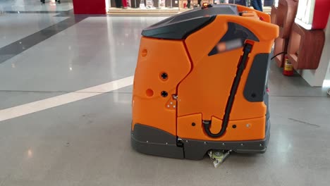 industrial cleaning robot cleans the floor in the mall