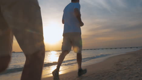 evening jogging along the beach at sunset