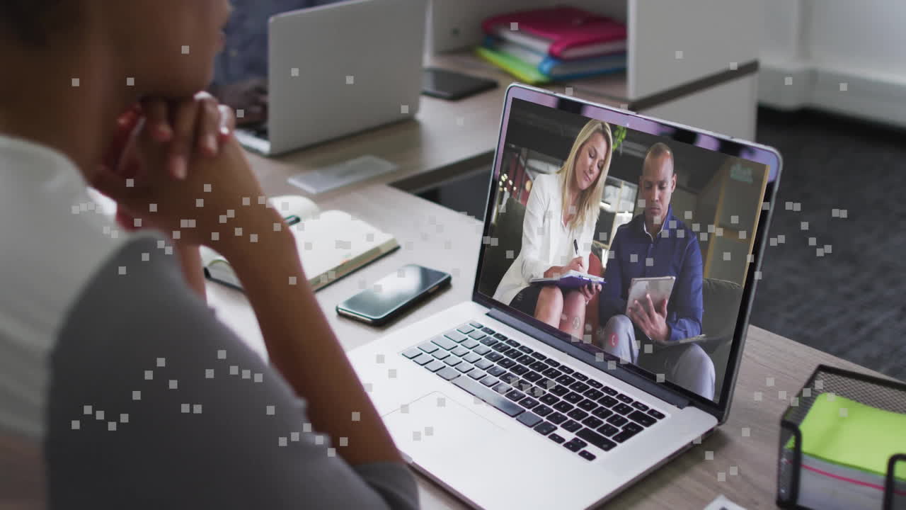 Business meeting video call on laptop with digital data animation overlay