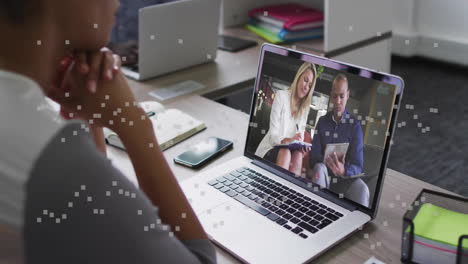 business meeting video call on laptop with digital data animation overlay