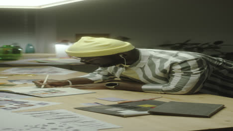 creative professional working on a design project at a desk