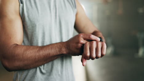 smart watch, hands and man in gym for fitness