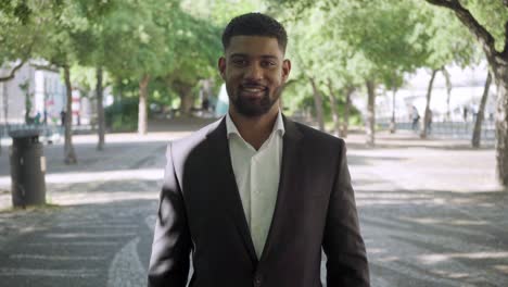 smiling african american businessman wearing formal suit.