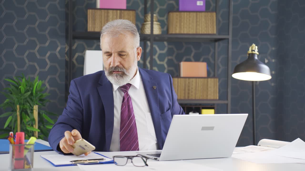 Stressed businessman experiencing time pressure.