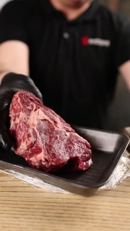 chef preparing raw steak