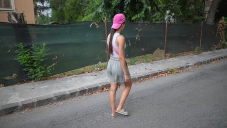 woman walking down a city street