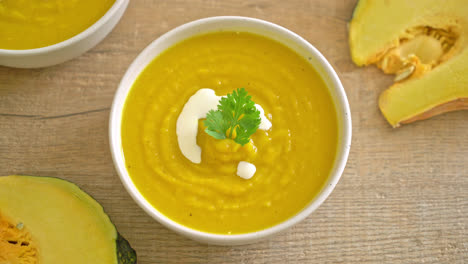 pumpkin soup in white bowl - vegetarian and vegan food style