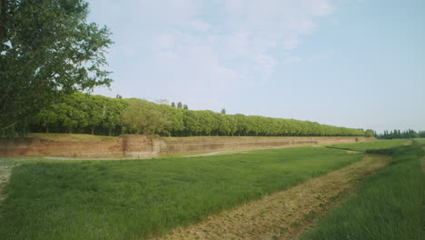 Master-shot-of-Ferrara's-middle-age-city-walls-during-a-bright-sunny-day-in-Italy