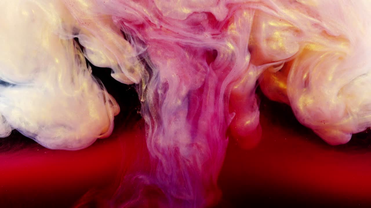 Abstract forms. Shooting on a black background. Mixing of paints