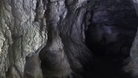 panning shot of a deep hole in kreo cave, semarang, central java, indonesia