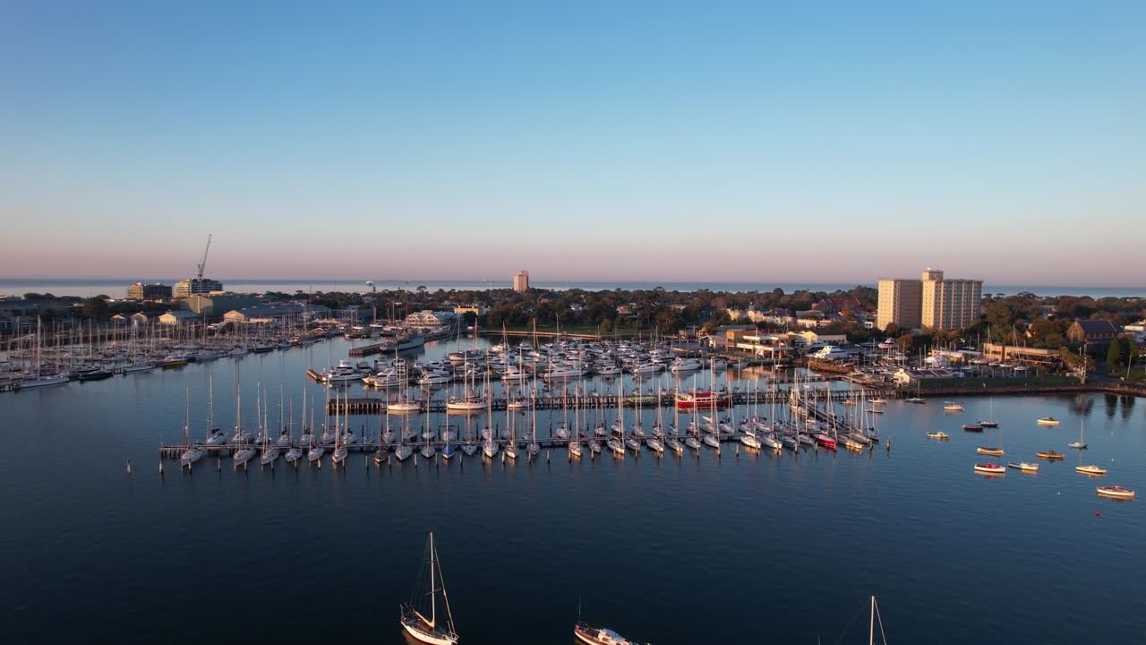 Aerial forward marina of Williamstown in the morning sunrise, scenic panorama