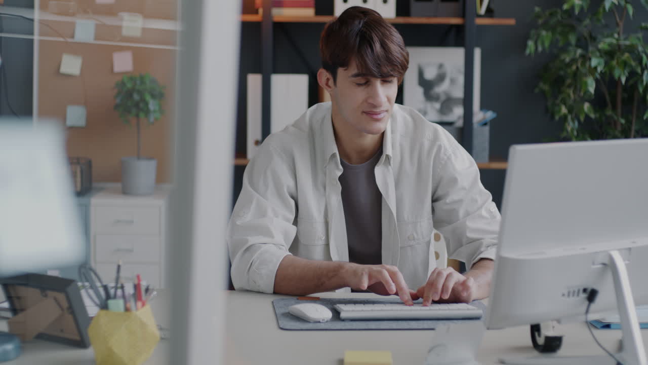 Man working on computer in a modern office