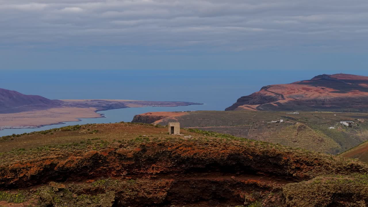 Aerial view of Lanzarote's Mirador de Gayo showcasing the volcanic landscape coastal scenery. Rising Shot