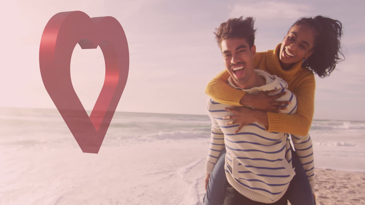 Smiling couple enjoying piggyback ride on beach with heart animation overlay