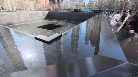 Twin Towers Memorial Pools, Reflected Absence, on a clear spring day in New York City