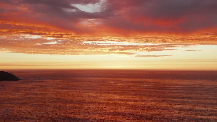 Orange Sunset Over The Calm Ocean In Cape Town, South Africa