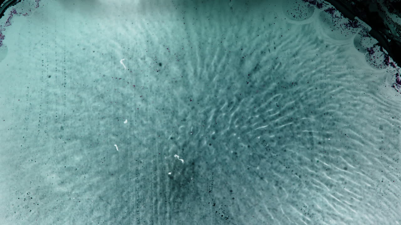 Close-up view of substances blending in a macro shot with a calm vibe