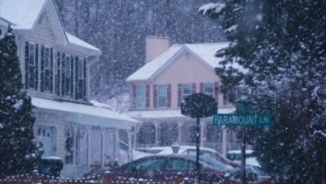 snow falling in slow motion in winter neighborhood