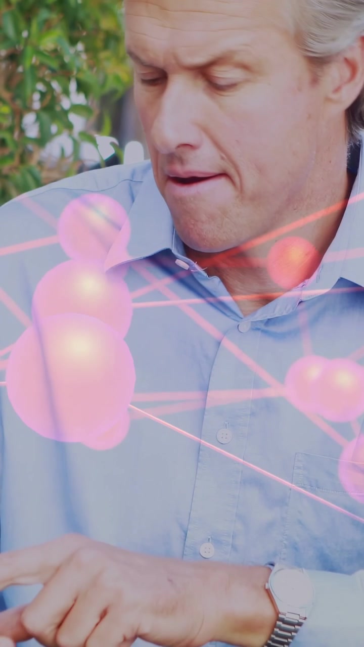 Vertical video: Man picking cup and sipping, grimacing, checking hand, pink overlay showing health