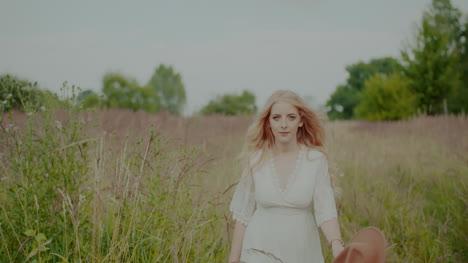beautiful smiling blonde woman walking and looking into camera 2