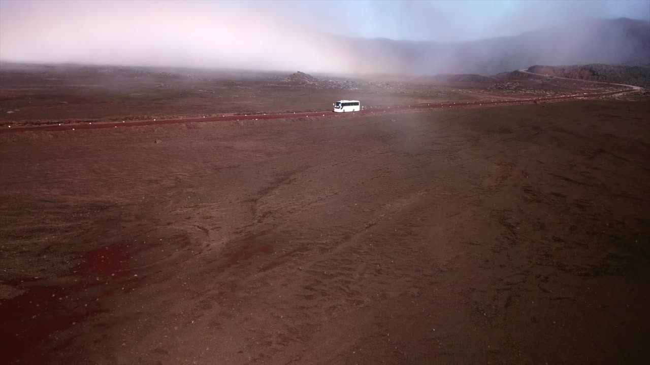 Bus crossing Plaine des sables filmed by a Drone, Reunion Island