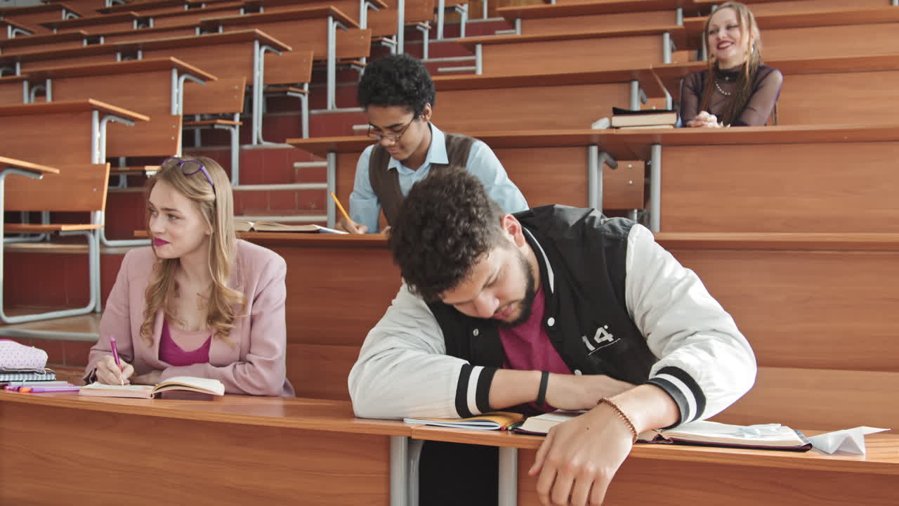 Bearded Young Student Sleeping at Class