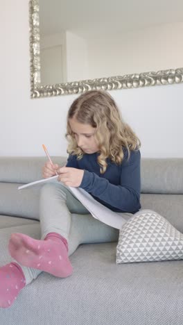 girl drawing on sofa