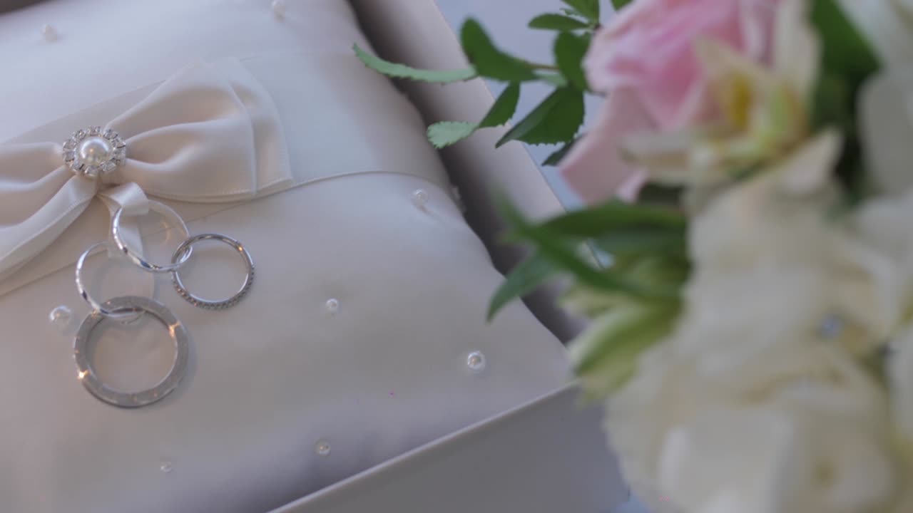 A Cushion with flowers and ribbons