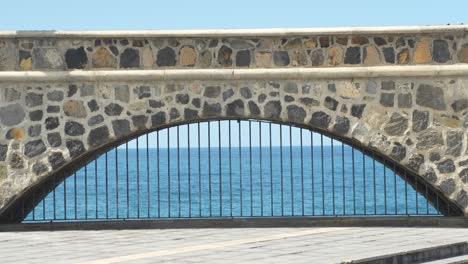 window in wall looking at the sea as deep as the horizon, tourist place of interest