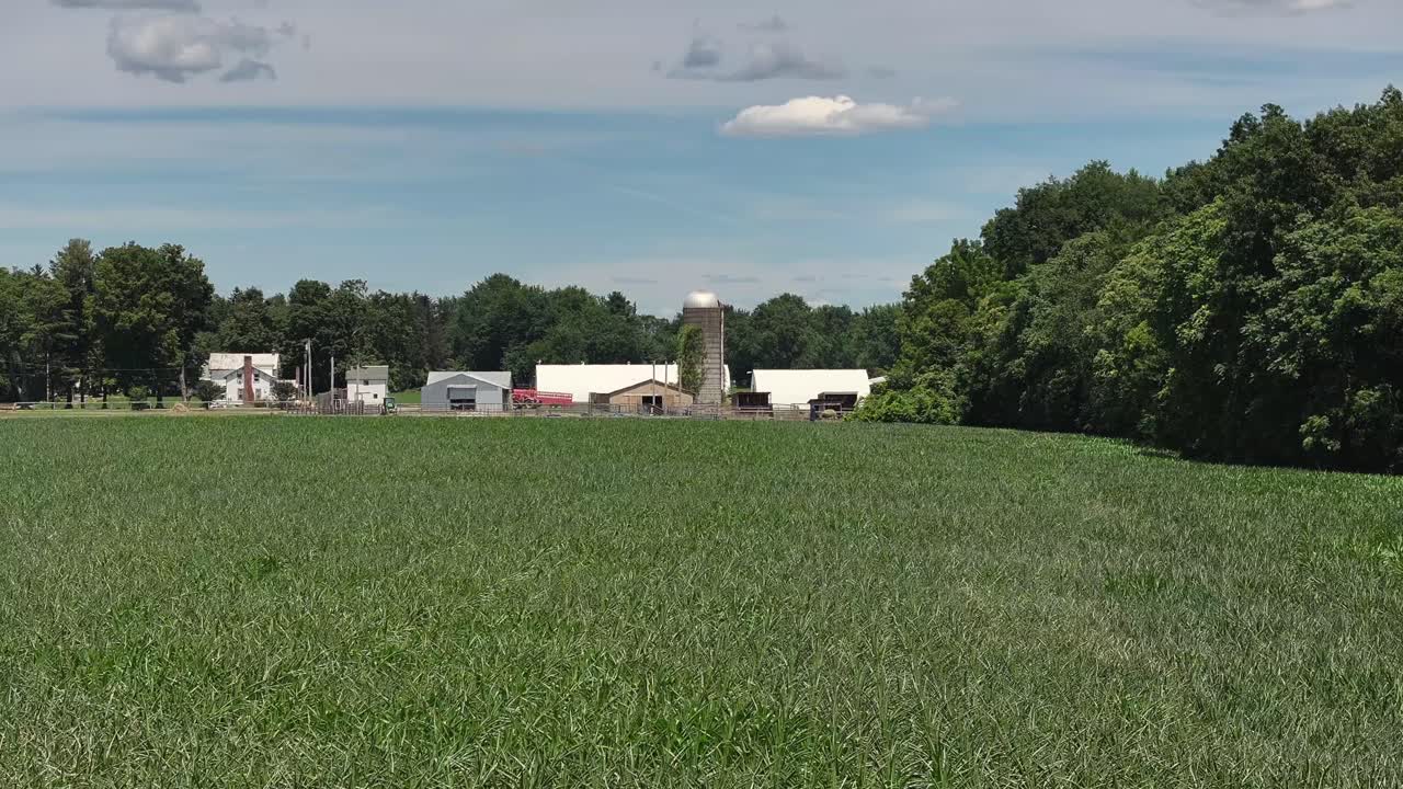 Drone view of farm and silo in Upstate New York 4K