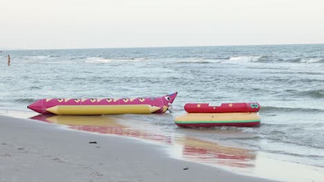 inflatable banana boat being pulled by a speedboat