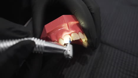 dental polishing demonstration with grinding drill - high angle close up