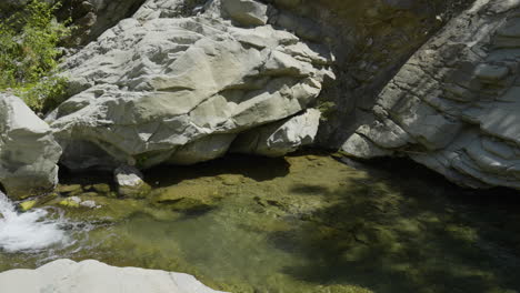 panning shot of small waterfall running into creek located in santa paula punch bowls southern california