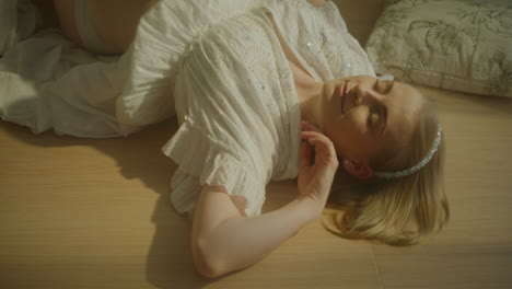 pregnant woman relaxing on sunny floor