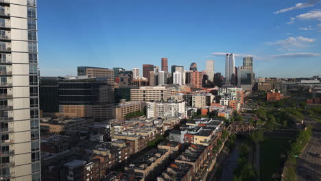 drone descending in front of the union station district and downtown denver, usa