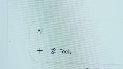close-up of a chat interface showing “ai” and a tools icon, indicating that artificial intelligence features are enabled and ready to assist the user
