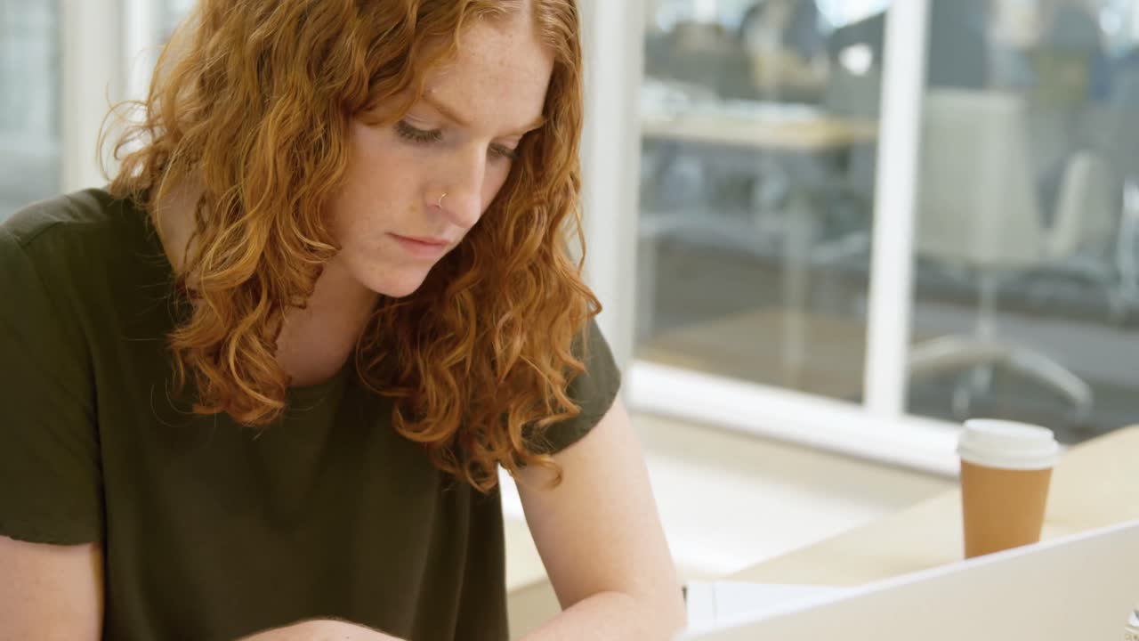 Businesswoman working on desk at office 4k