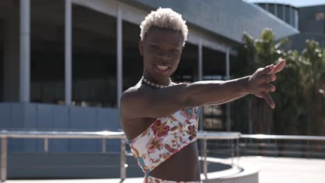 joyful transgender woman dancing outdoors.