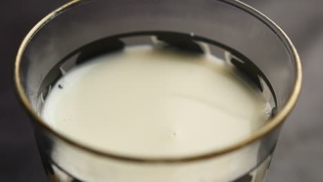 pouring fresh milk into a glass