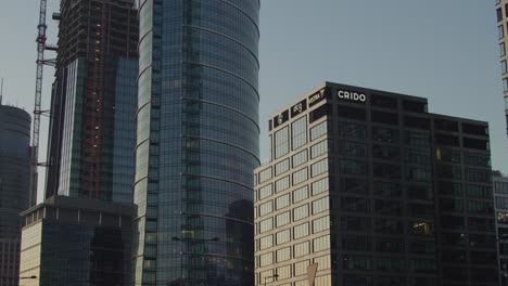 a slow, horizontal camera movement showcasing warsaw's skyscrapers at twilight.