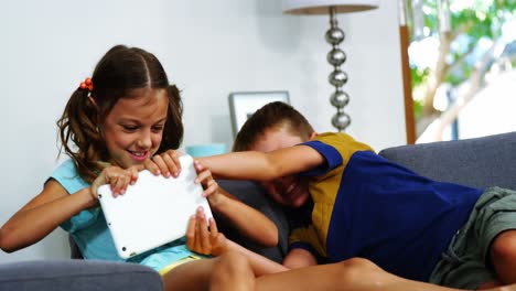 Siblings-having-fun-together-in-living-room