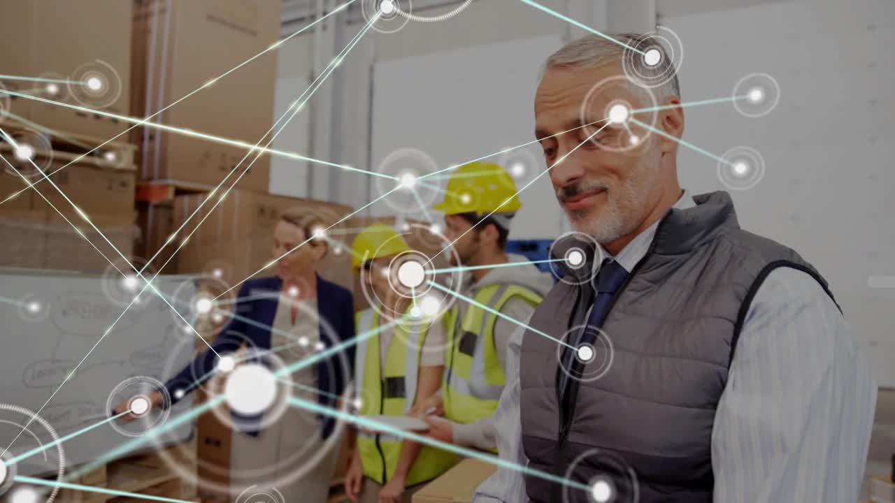 Supervisor pointing board and starting network overlay connecting tablet, team planning logistics