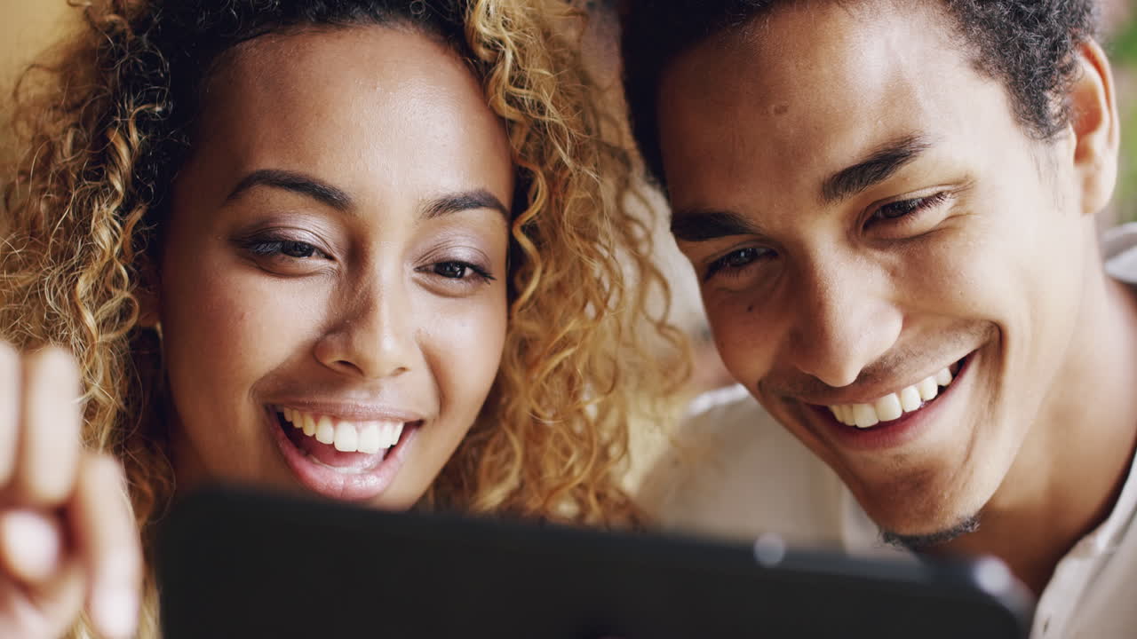 Couple using digital tablet touchscreen ipad watching movies