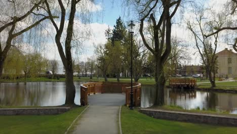 aerial of catwalk on pond in urban park