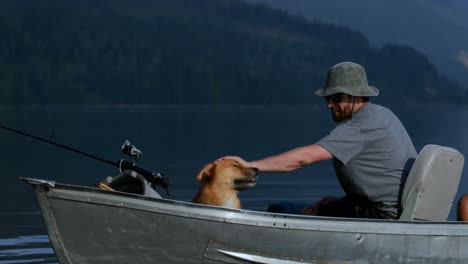 fishermen travelling with his dog in the boat 4k