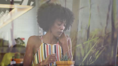 Video-De-Luces-Sobre-Una-Mujer-Birracial-Sentada-En-Un-Restaurante.