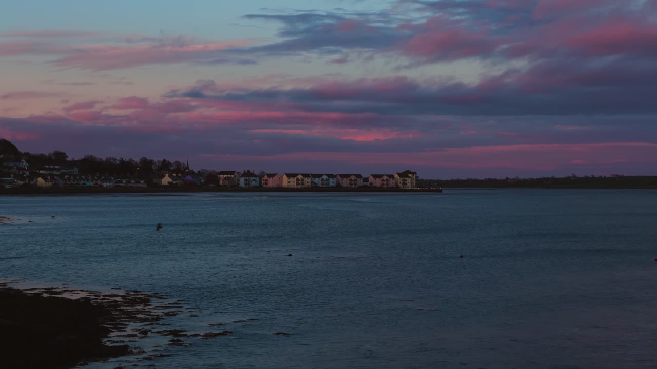 Scenic Sunset Sky Above Seaside Houses in Dundrum Northern Ireland