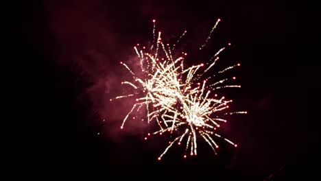 fireworks display at dark night sky in slow motion grand finale blur