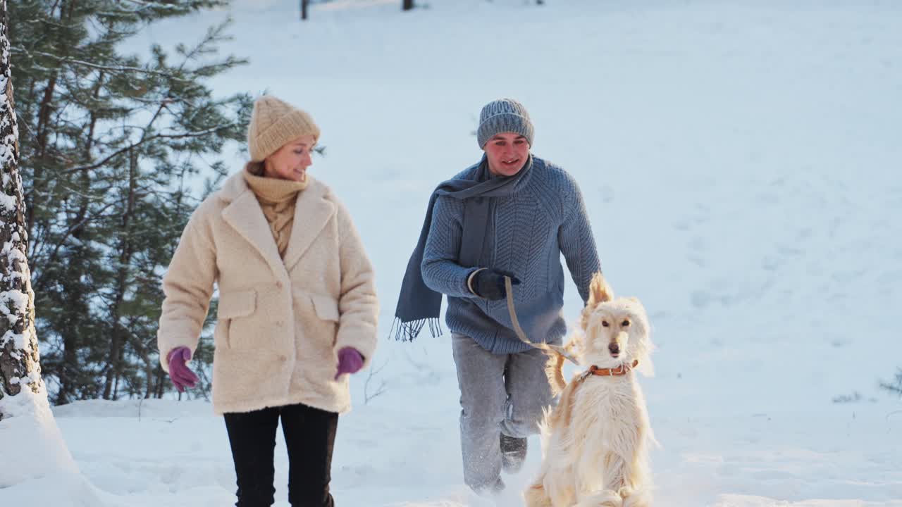 Couple and Dog Enjoying a Winter Day
