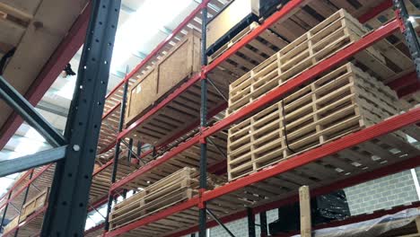 Boxes,-pallets-and-crates-stacked-up-in-a-warehouse